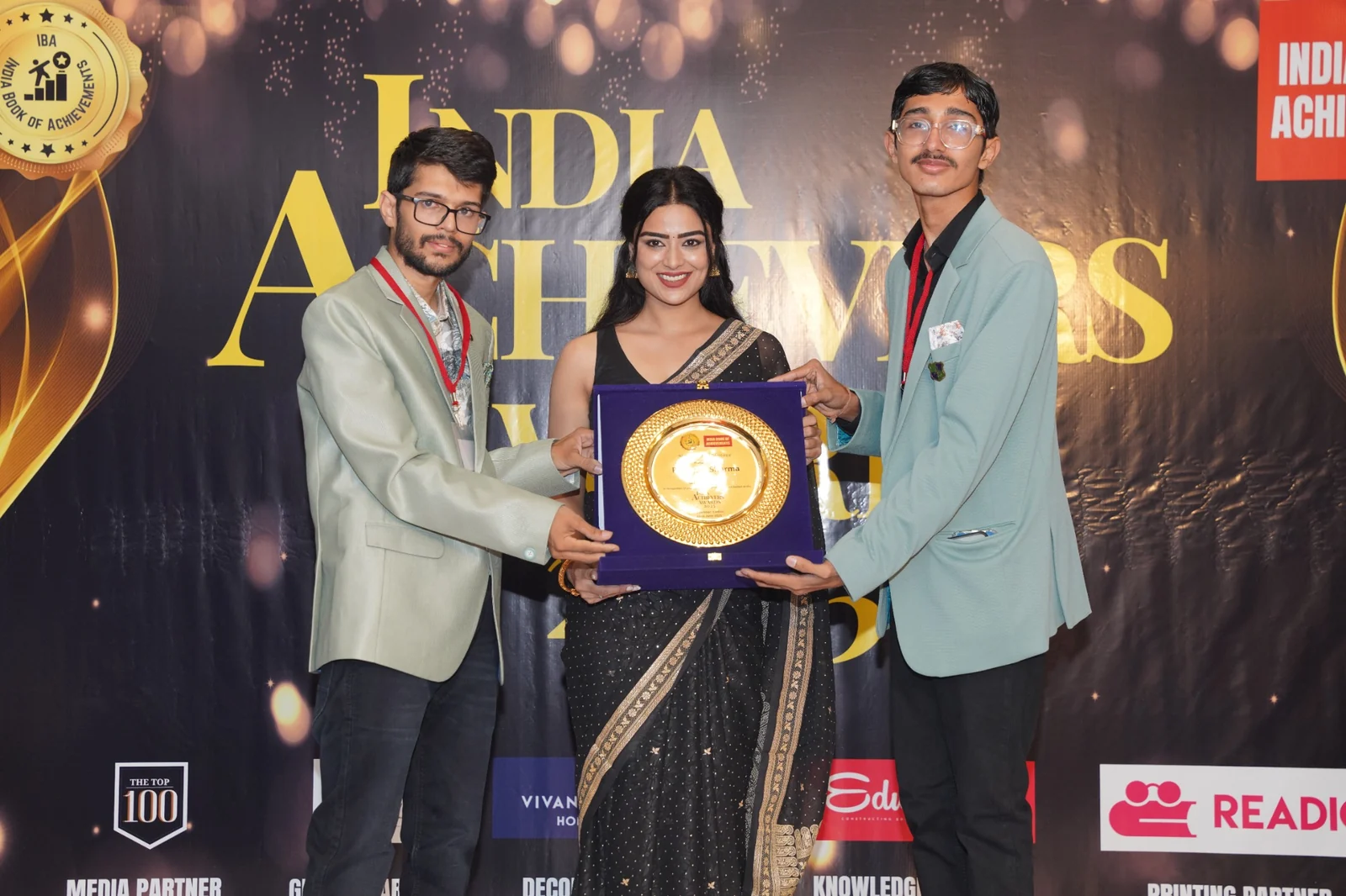 On-stage award presentation at India Book of Achievements recognition event